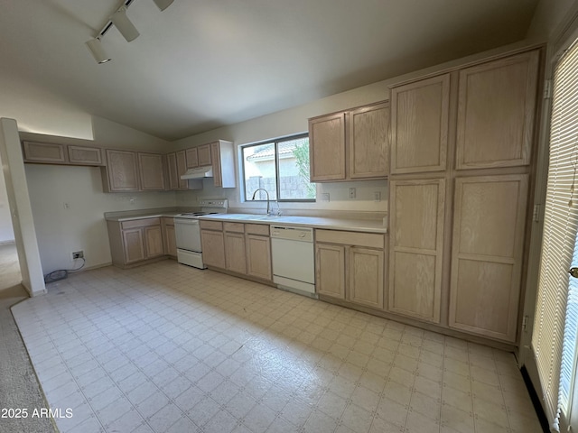 kitchen featuring light floors, lofted ceiling, light brown cabinetry, white appliances, and under cabinet range hood