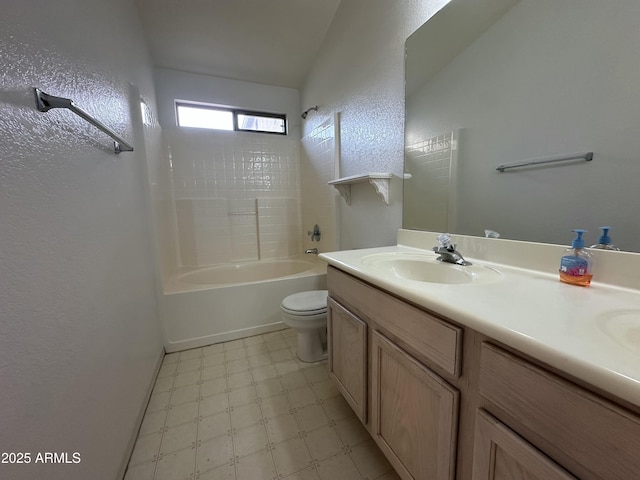 bathroom featuring double vanity, toilet, washtub / shower combination, a sink, and tile patterned floors