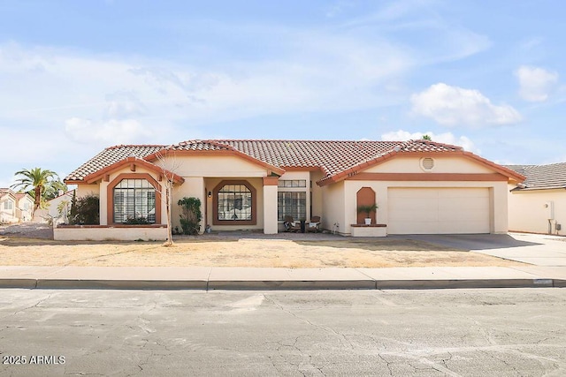 mediterranean / spanish-style house featuring a garage