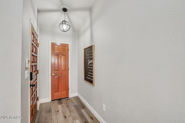 doorway to outside with light wood-type flooring