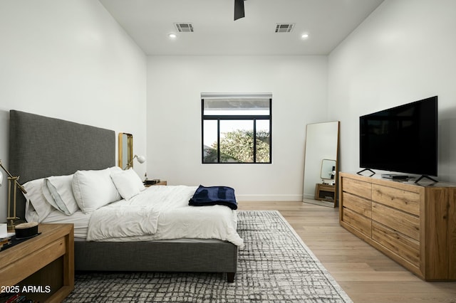 bedroom featuring ceiling fan, light wood-type flooring, visible vents, and recessed lighting