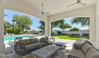 view of patio / terrace featuring ceiling fan, an outdoor hangout area, and a fenced in pool