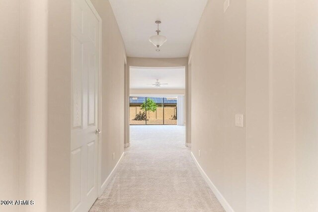 corridor with light colored carpet