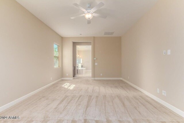 carpeted empty room with ceiling fan