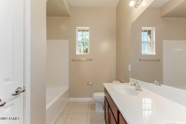 bathroom with tile patterned floors, vanity, and toilet