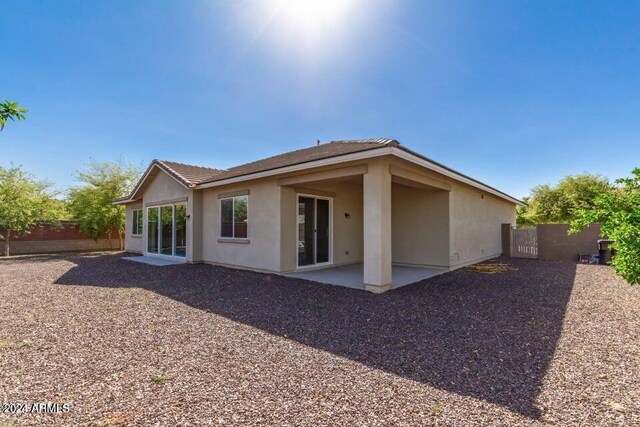 back of property featuring a patio area