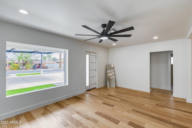 unfurnished room with baseboards, recessed lighting, light wood-type flooring, and a ceiling fan