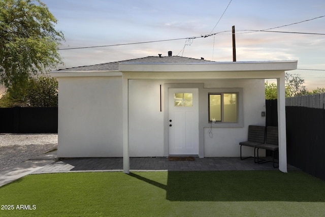 view of outbuilding with fence