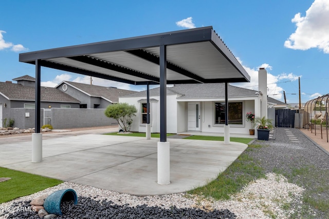 view of patio featuring fence