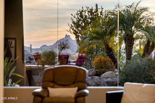 living area featuring a mountain view