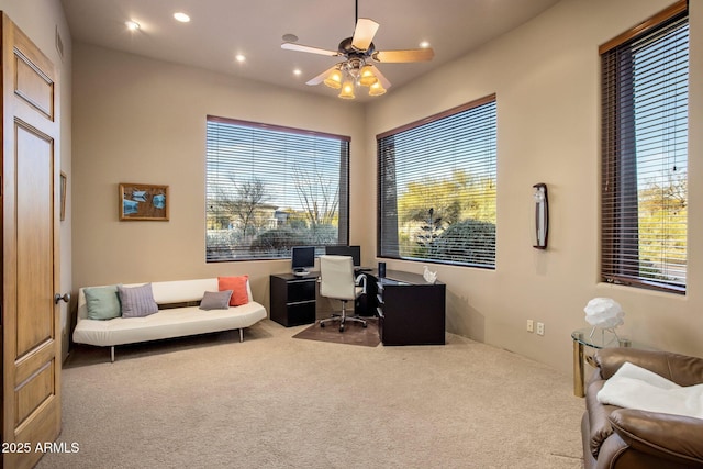 office area with ceiling fan and carpet flooring