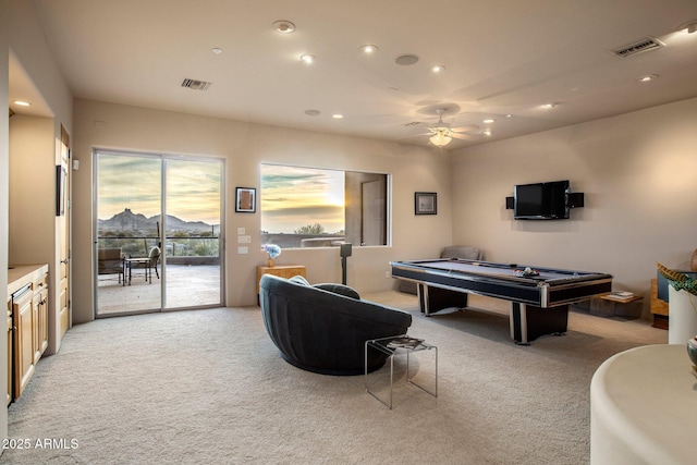 recreation room featuring ceiling fan and light carpet