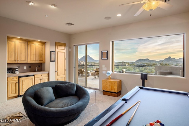 rec room featuring ceiling fan, a mountain view, light carpet, and pool table