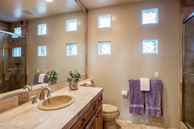 bathroom featuring plenty of natural light, toilet, and a shower with door