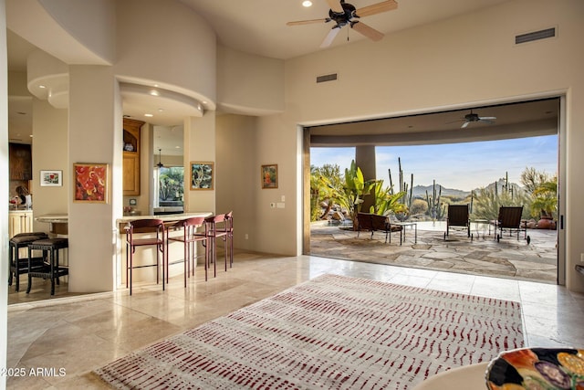 bedroom featuring a high ceiling and access to exterior