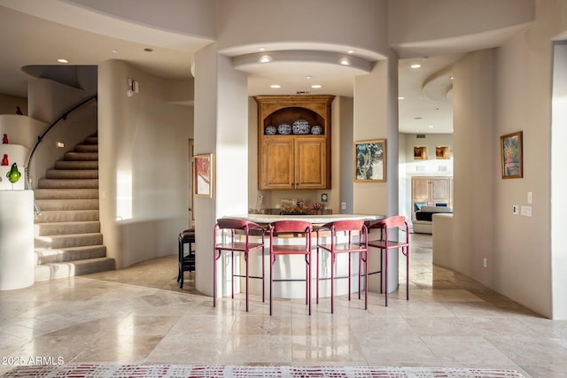 kitchen with a breakfast bar and kitchen peninsula