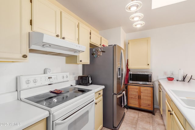 kitchen featuring sink, light tile patterned floors, and appliances with stainless steel finishes