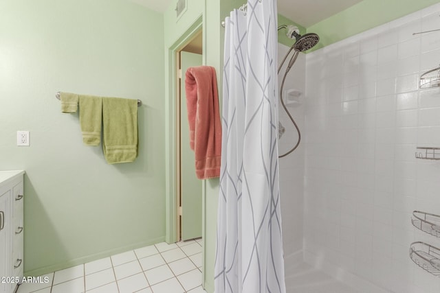 bathroom with walk in shower, tile patterned floors, and vanity