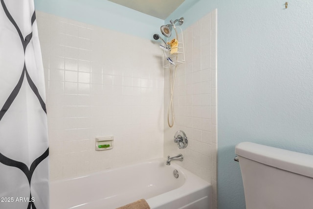 bathroom featuring toilet and shower / bath combo