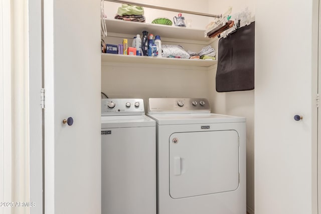 clothes washing area with washer and dryer