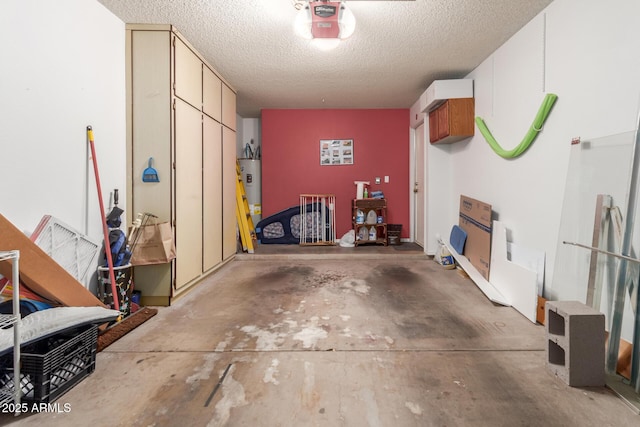 garage with water heater and a garage door opener