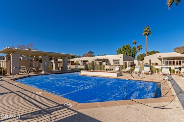 view of swimming pool featuring a patio