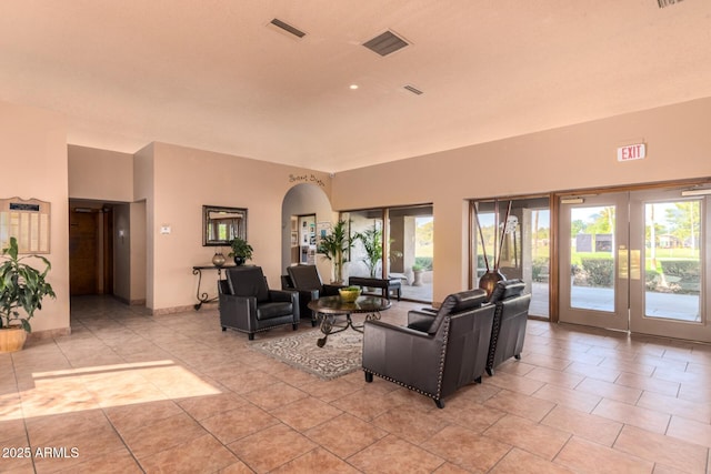 living room with light tile patterned floors and a wealth of natural light