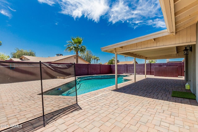 view of swimming pool with a fenced backyard, a fenced in pool, and a patio area