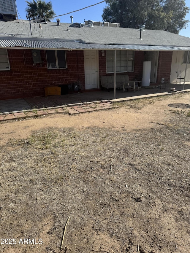 3226 W Maryland Ave, Phoenix, AZ 85017 - view of front of home featuring brick siding, a patio area, and central AC unit