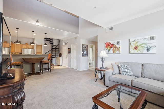 20100 N 78th Pl Unit 2193, Scottsdale, AZ 85255 - living room with light carpet, stairs, and ornamental molding