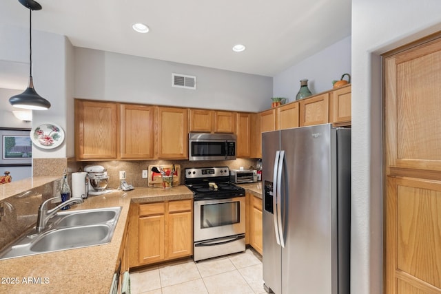 20100 N 78th Pl Unit 2193, Scottsdale, AZ 85255 - kitchen featuring stainless steel appliances, light tile patterned floors, backsplash, light countertops, and pendant lighting
