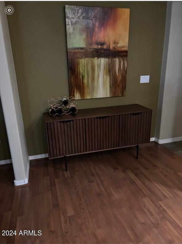 interior space with hardwood / wood-style floors and radiator