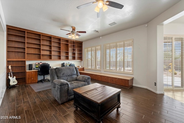 5005 E Baker Dr, Cave Creek, AZ 85331 - living area featuring wood tiled floor, visible vents, and a ceiling fan