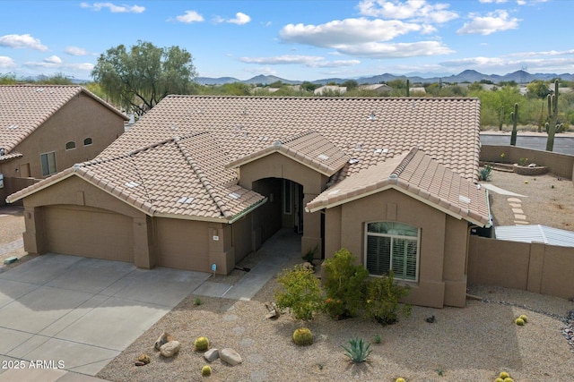 5005 E Baker Dr, Cave Creek, AZ 85331 - view of front of house with stucco siding, a tile roof, a mountain view, and a garage