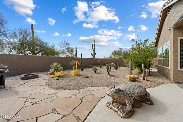5005 E Baker Dr, Cave Creek, AZ 85331 - view of patio featuring a fenced backyard and a fire pit