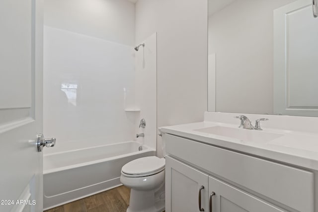 full bathroom featuring shower / tub combination, hardwood / wood-style flooring, vanity, and toilet