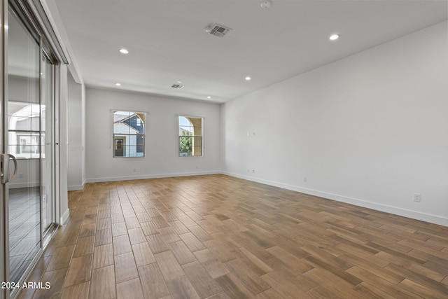 unfurnished room featuring hardwood / wood-style floors