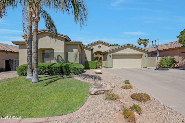 view of front facade with a front yard and a garage