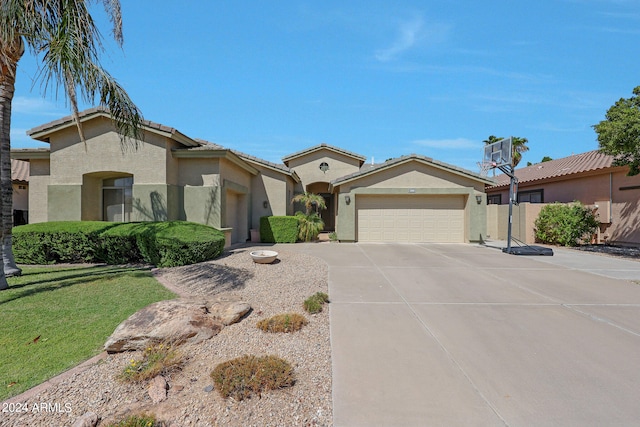 view of front of house featuring a front yard and a garage