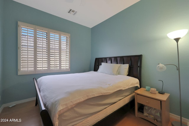 bedroom with lofted ceiling