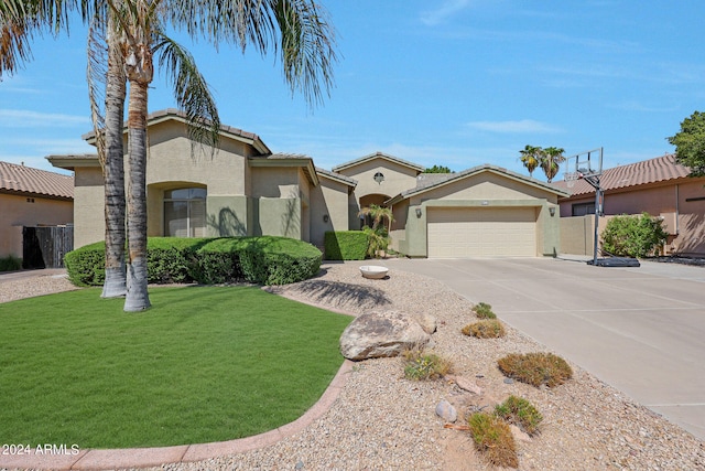 view of front facade with a front lawn and a garage