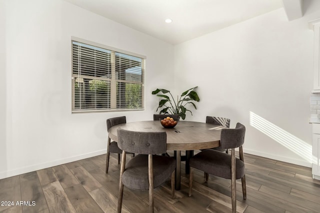 dining space featuring dark hardwood / wood-style floors