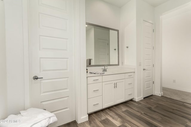 bathroom featuring vanity and wood-type flooring