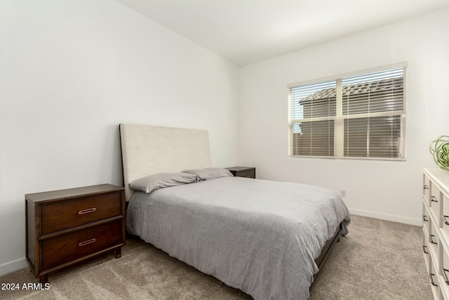 bedroom with light carpet