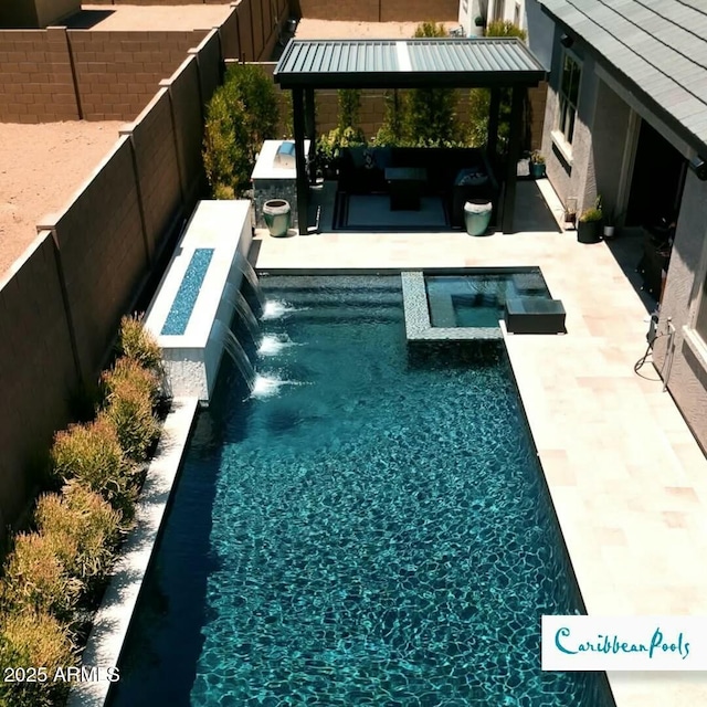 view of pool with a gazebo, an outdoor living space, a patio, and pool water feature