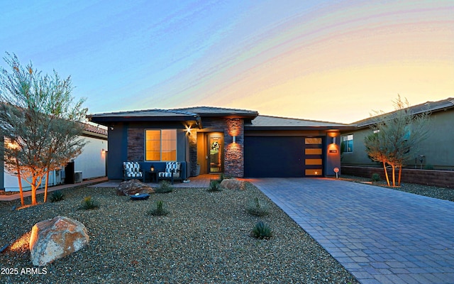 prairie-style home featuring a garage