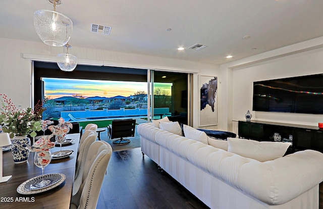 living room with dark hardwood / wood-style flooring