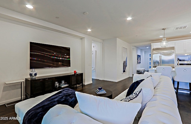 living room with dark hardwood / wood-style floors