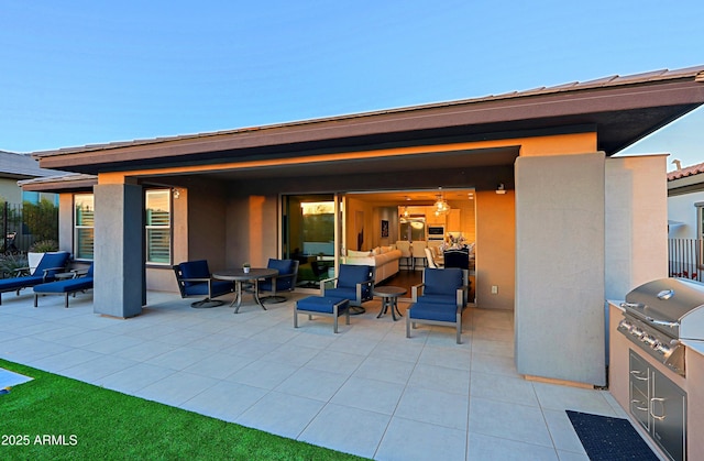 view of patio with a grill and an outdoor kitchen