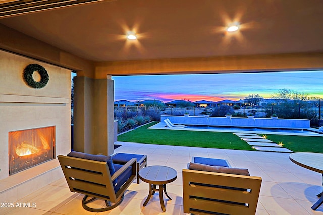 patio terrace at dusk with a fireplace